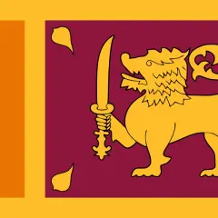 Flaga Sri Lanki z lwem i mieczem, symbol wolności i niezależności. Planujesz podróż? Sprawdź, czy potrzebna jest wiza Sri Lanka.