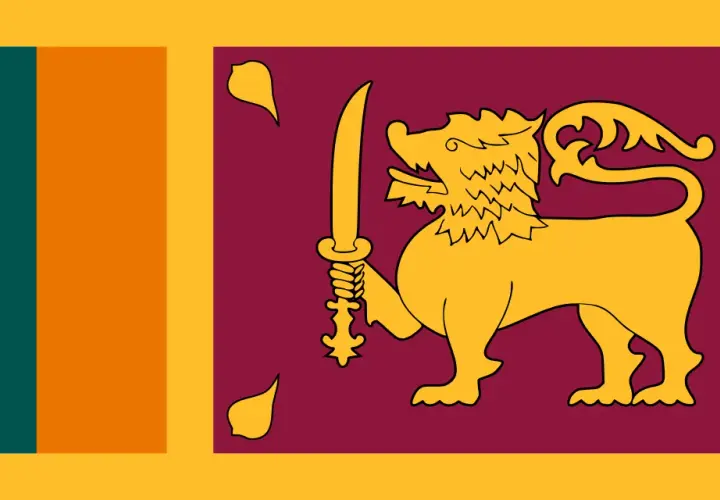 Flaga Sri Lanki z lwem i mieczem, symbol wolności i niezależności. Planujesz podróż? Sprawdź, czy potrzebna jest wiza Sri Lanka.